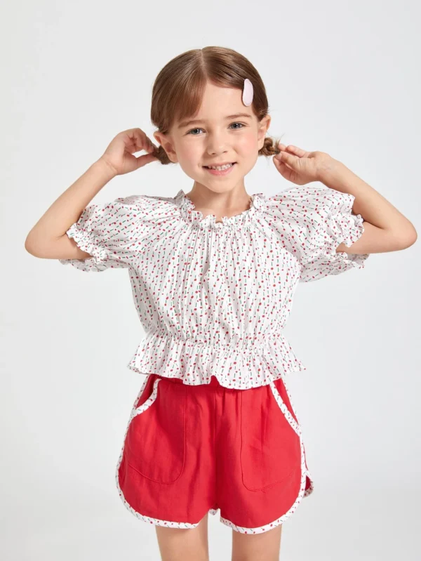 Conjunto top peplum ribete con fruncido de lunares con shorts