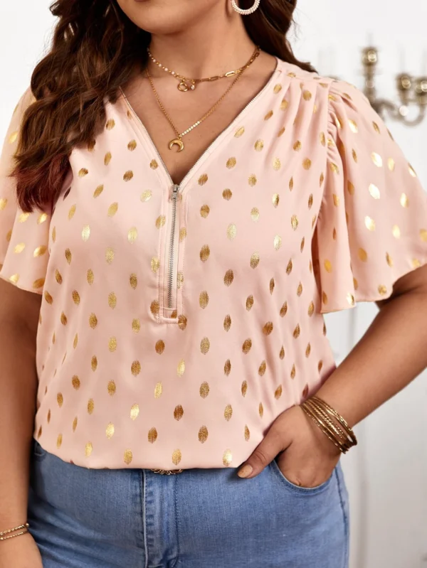 Blusa con estampado de lunares dorados cremallera media