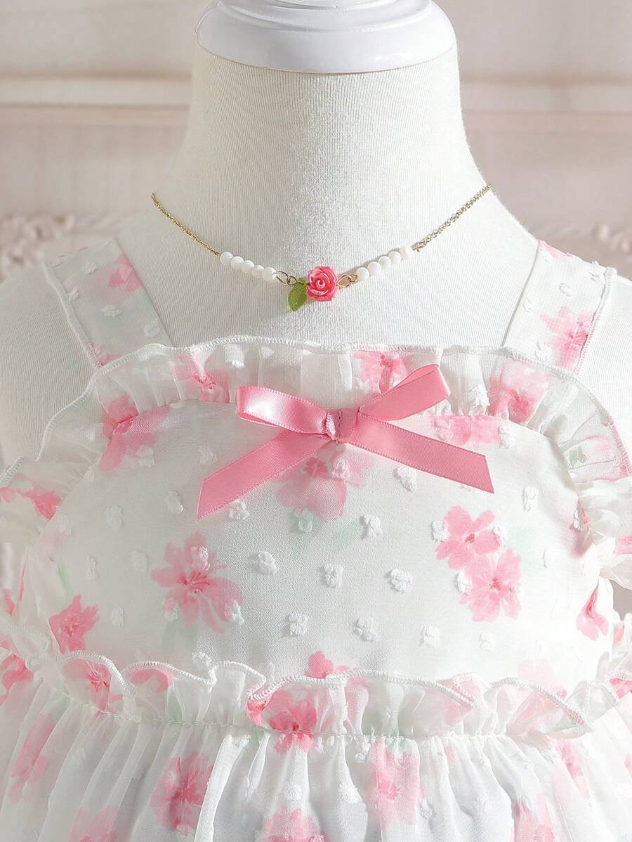 Lindo vestido para bebé niña con detalles de lazo y diseño de flores ideal para uso al aire libre en verano - Imagen 2