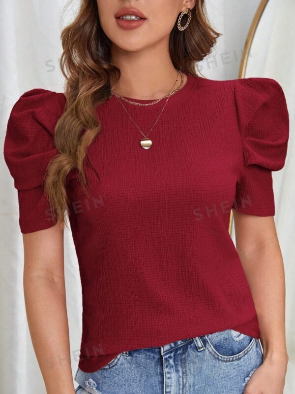Blusa unicolor de manga farol