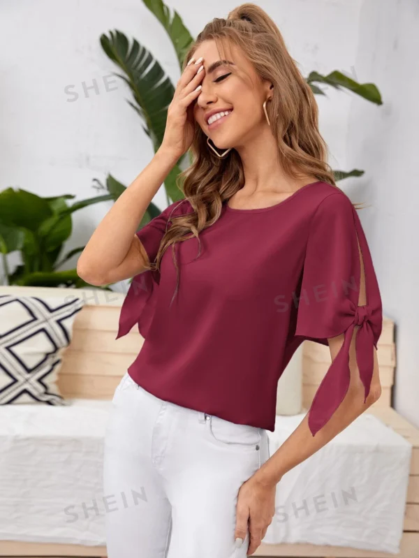 Blusa unicolor de puño con nudo
