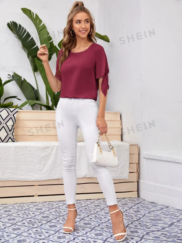Blusa unicolor de puño con nudo - Imagen 2