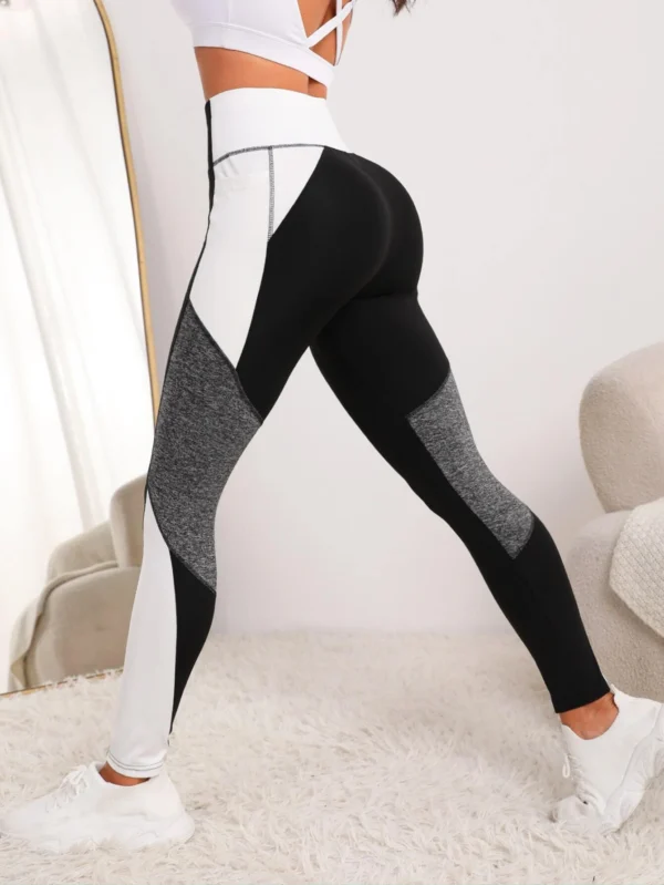 Leggings deportivos de color combinado con bolsillo para teléfono