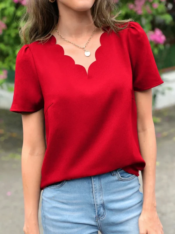 Blusa roja con manga abullonada y ribete de concha