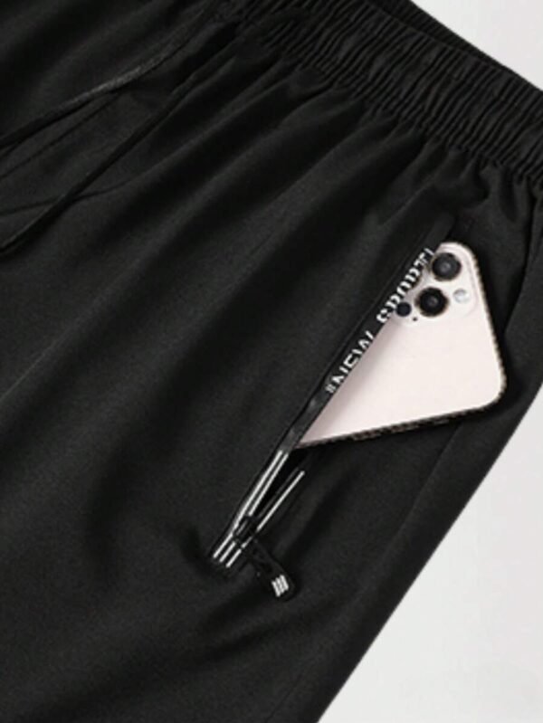Pantalones cortos negros con cordón y bolsillos con cremallera - Imagen 3
