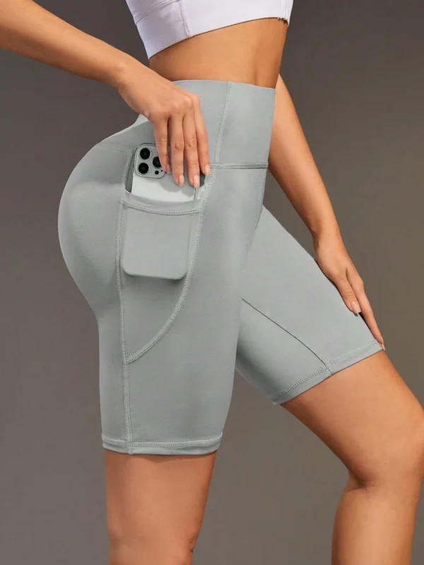 Pantalones cortos deportivos sin costuras con bolsillo para el gimnasio