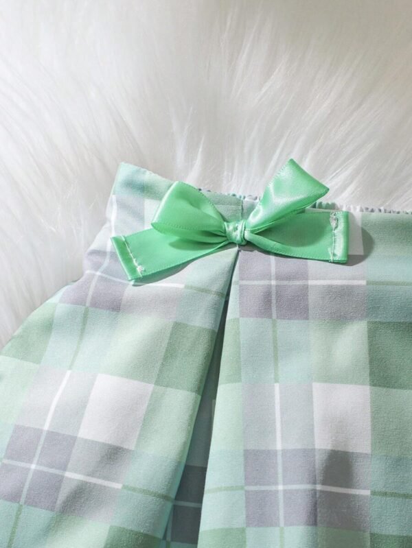 Falda mini plisada con estampado a cuadros y lazo - Imagen 2