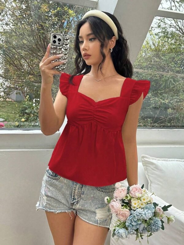 Blusa con textura de unicolor con pliegues en el pecho