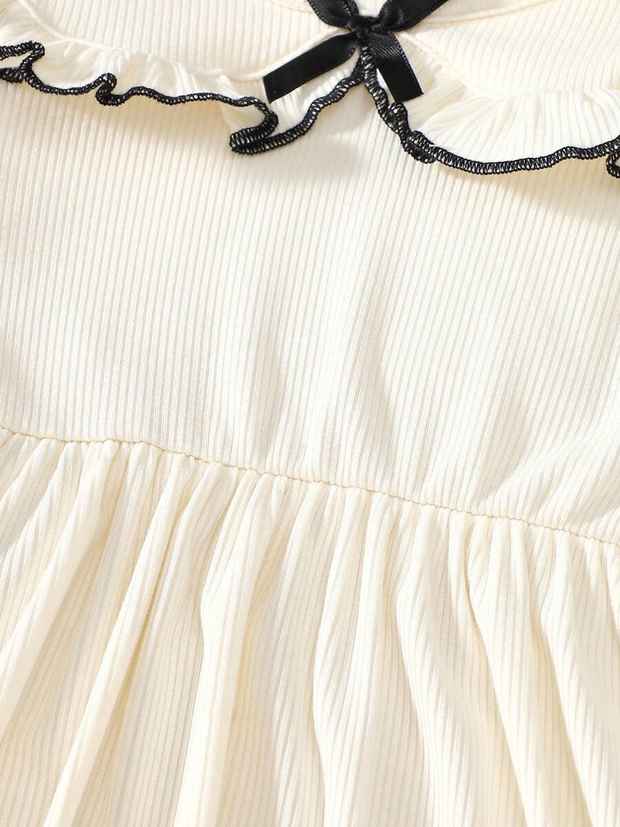 Vestido manga larga blanca, puños con lazo y dobladillo con volantes - Imagen 2