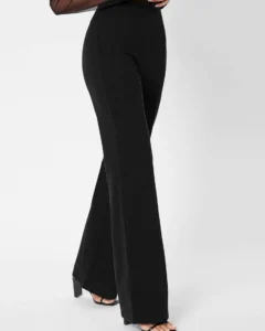 Pantalones palazzo unicolor con cremallera trasera