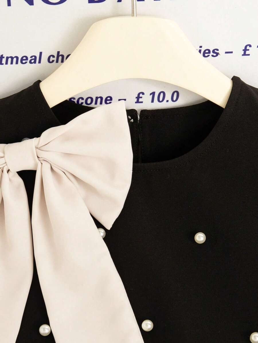 Vestido con volantes, lazo de perlas y estilo francés - Imagen 2