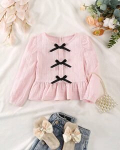 Blusa de manga larga con cuello redondo y decoración de moño