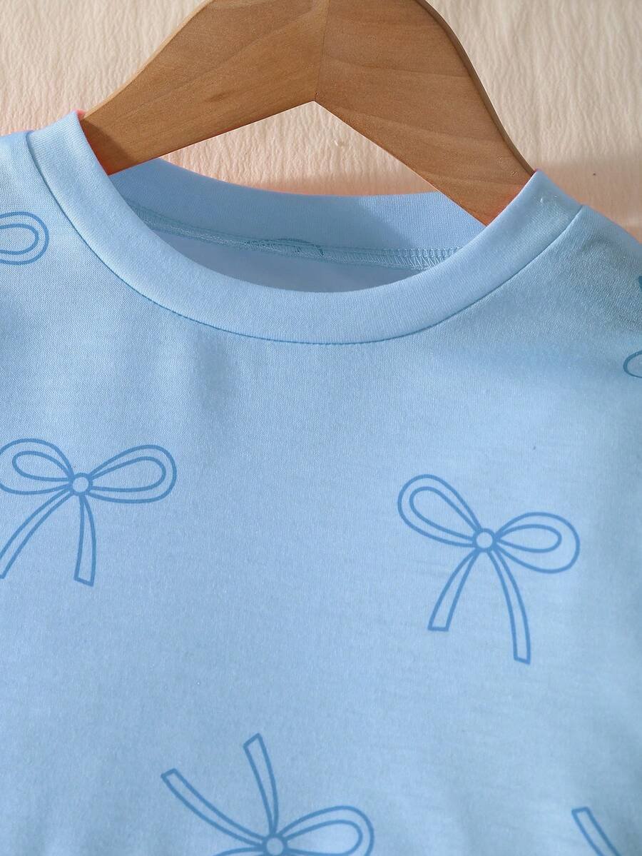 Camiseta de manga raglán, cuello redondo y pantalones vaqueros rectos - Imagen 2