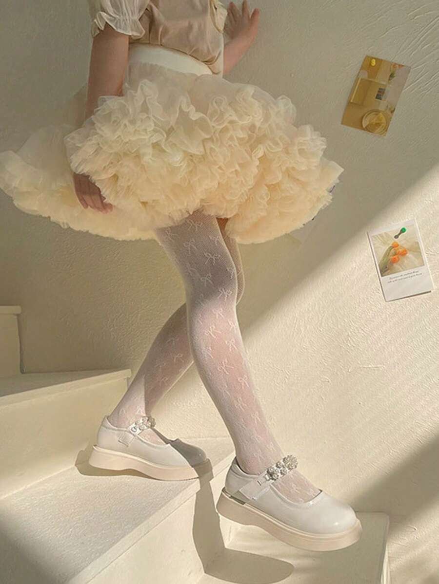 Medias con diseño calado de mariposa en beige para niñas - Imagen 2