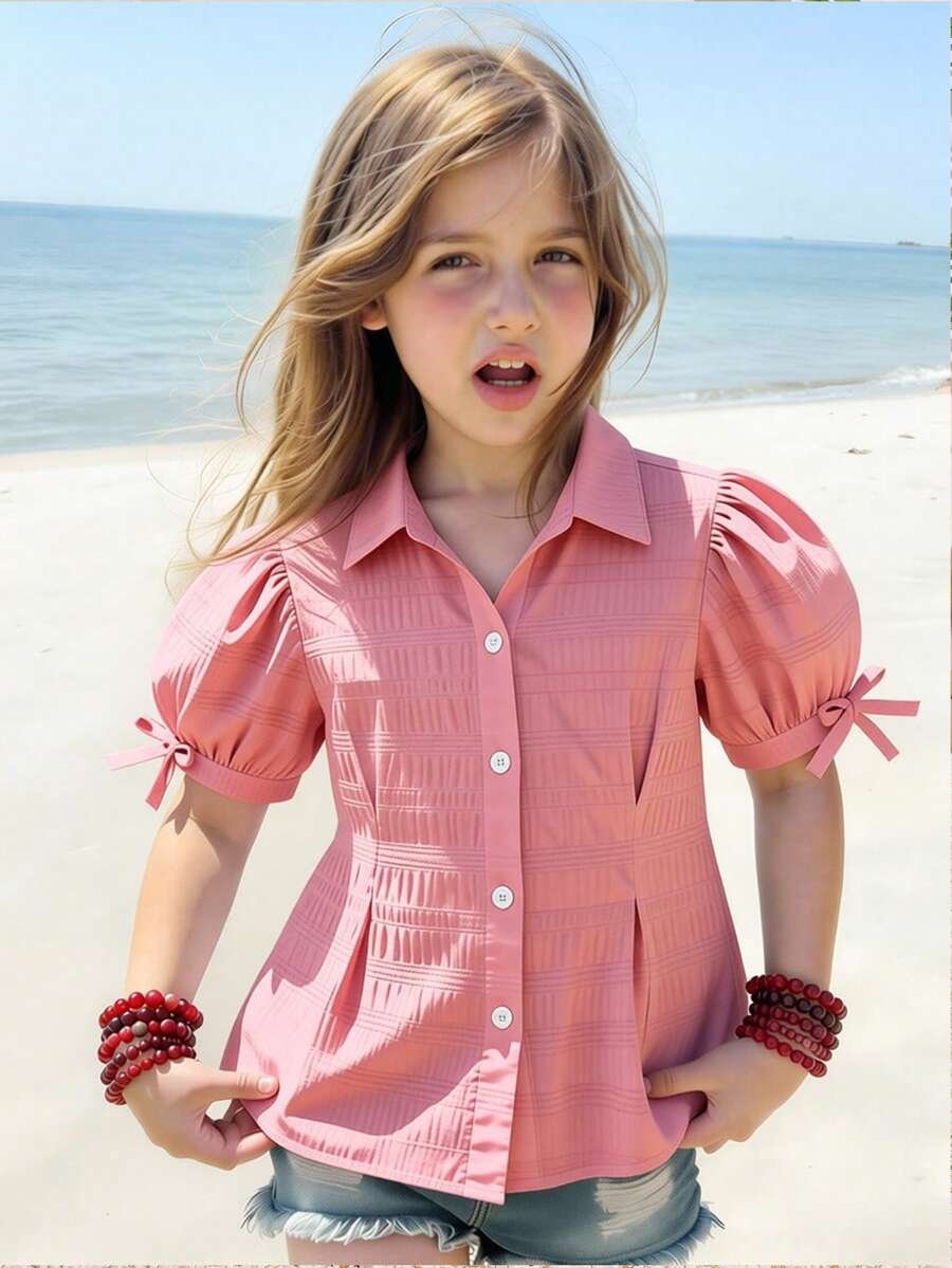 Blusa de cuadros rojos, manga abullonada y volante en el bajo