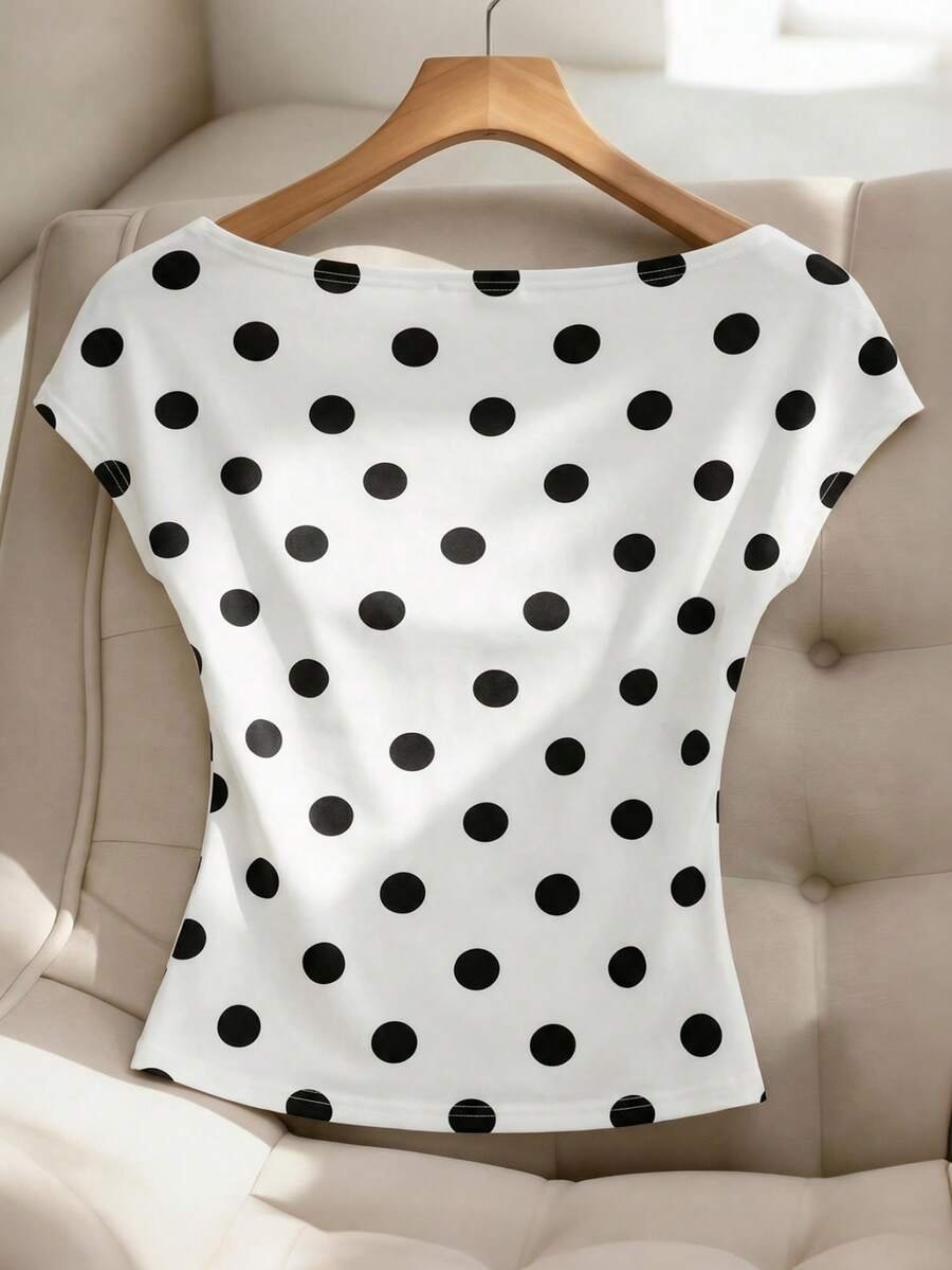 Blusa con cuello asimétrico y estampado de lunares elegante - Imagen 3
