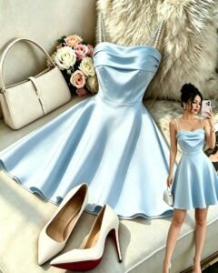 Vestido elegante y versátil sin mangas de tela brillante